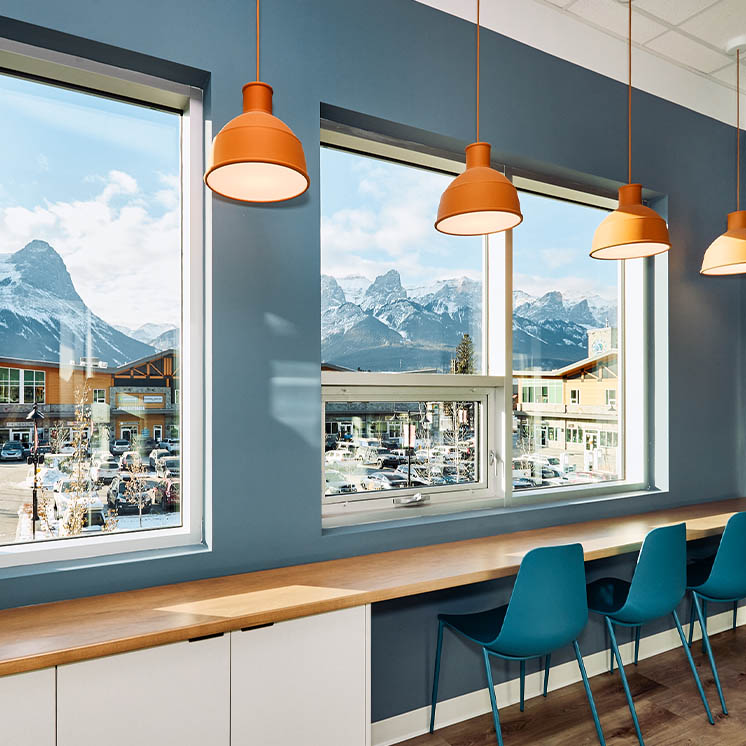 Field law open office workspace overlooking mountains Field law open office workspace overlooking mountains